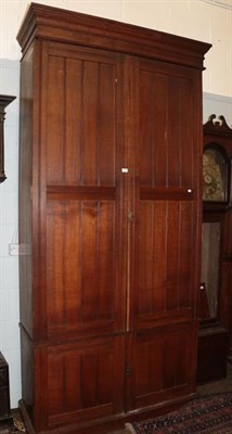 Lot 1332 - A late 19th/ early 20th century oak country house cupboard of large proportions, the moulded...