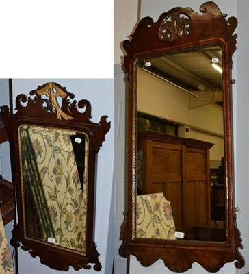 Lot 1337 - A large Georgian fret cut wall mirror, 112cm high, together with a similar smaller mirror