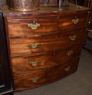 Lot 1350 - An early 19th century mahogany bowfront chest of drawers, two short drawers over three long,...