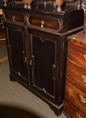 Lot 1351 - An oak fitted linen cupboard with tray, two drawers over two cupboard doors, 120cm high by...