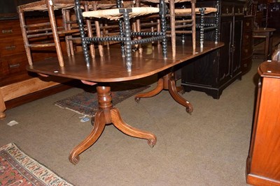 Lot 1354 - A 19th century mahogany D-end dining table, with a single leaf raised on twin tripod bases,...