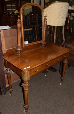 Lot 1360 - A late 19th century satinwood dressing table with swing mirror and two drawers, turned and...