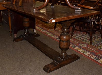 Lot 1362 - An oak refectory table, with cup and cover supports and trestle base, 152cm long