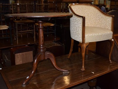 Lot 1363 - An oak tilt top occasional table, together with a tub chair (2)