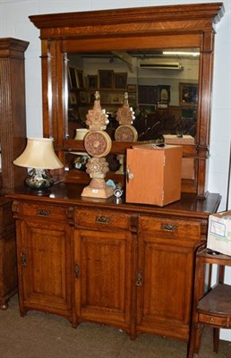 Lot 1367 - An early 20th century oak mirror backed sideboard with Art Nouveau stylised handles, 230cm high...