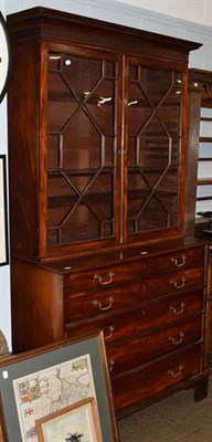 Lot 1369 - A George III mahogany secretaire bookcase, dentil moulded and blind fret carved cornice above...