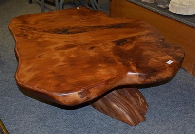 Lot 1379 - A modern coffee table, top made from single slice of timber on a root base, 130cm diameter