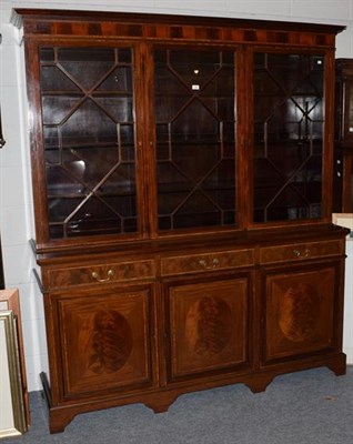 Lot 1386 - An inlaid and crossbanded mahogany astragal glazed triple bookcase; together with a large blue rug