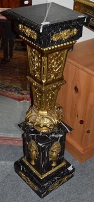 Lot 1389 - A striated black marble and gilt-brass mounted plinth, 115cm high