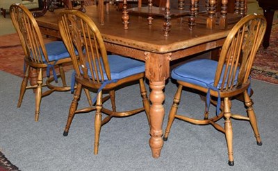 Lot 1399 - A pine kitchen table, together with a set of four spindle back chairs