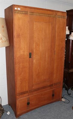 Lot 1436 - An Arts & Crafts Oak Wardrobe, with ebony stringing, the single door above a drawer, 107.5cm...