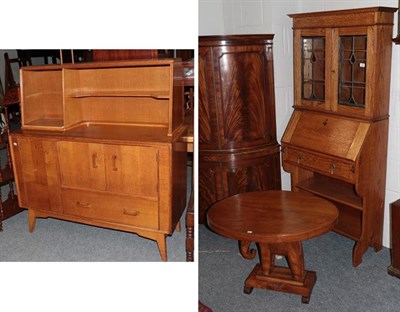 Lot 1438 - A small bureau bookcase, G-Plan sideboard, Indian oval shaped table (3)