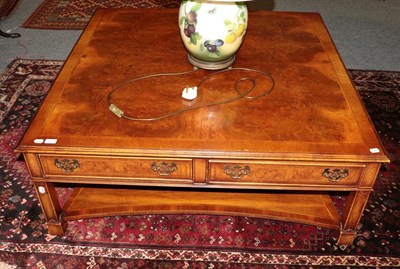 Lot 1441 - A burr walnut veneer square form coffee table, comprising four side drawers, from Barker &...