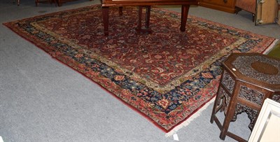 Lot 1451 - Mahal carpet, the brick red field with an all over design of angular view flower heads of...