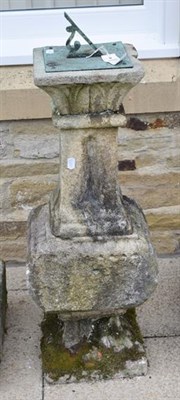 Lot 1456 - A sundial raised upon a stone pedestal