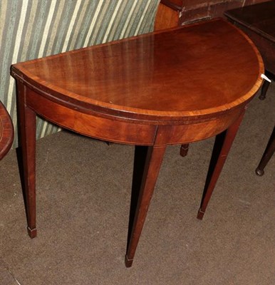 Lot 1321 - A George III mahogany folding card table