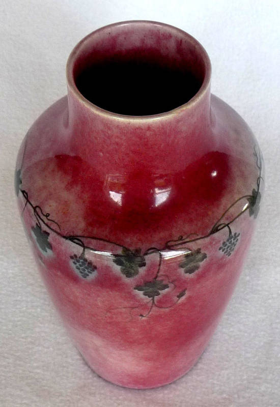 Lot 1424 - A Ruskin Pottery Vase, painted band of grape vines, on a pink ground, painted scissors mark and...