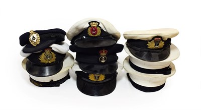Lot 85 - Three Elizabeth II Royal Navy Peaked Caps, each with raised bullion thread embroidered badge, woven