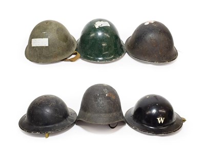 Lot 90 - A Collection of British Military Headgear, comprising two Second World War black painted Brodie...
