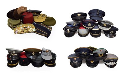 Lot 94 - A Collection of Various Post-War Continental and Soviet Russian Headgear, including sixteen...