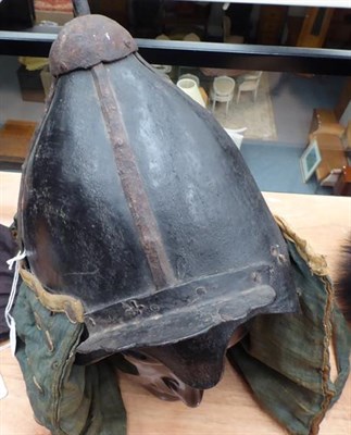 Lot 98 - A Korean ''War'' Helmet, possibly 17th Century, of  black lacquered leather with four vertical...