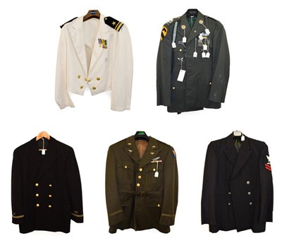 Lot 130 - A Second World War U.S. Army Air Force Officer's Green Tunic, set with various metal insignia...