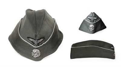 Lot 134 - A German Third Reich SS Officer's Overseas Cap, in field grey wool mix, the fold-down sides...
