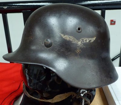Lot 143 - A German Third Reich M35 Double Decal Luftwaffe Helmet, with brown/grey finish, Luftwaffe and...