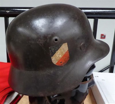 Lot 143 - A German Third Reich M35 Double Decal Luftwaffe Helmet, with brown/grey finish, Luftwaffe and...