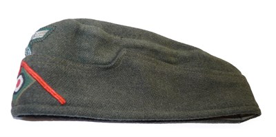 Lot 144 - A German Third Reich Artillery EM/NCO's Overseas Cap, with machine woven eagle and swastika...