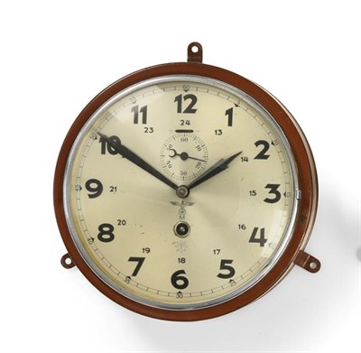 Lot 146 - A German Third Reich Kriegsmarine Bulk Head Clock, in a brown painted sheet brass drum case,...