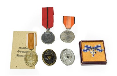 Lot 156 - Six German Third Reich Awards, comprising a 1936 Olympic Games commemorative medal, two Wound...
