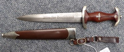 Lot 170 - A German Third Reich SA Dagger, the 22cm double edge steel blade etched Alles fur Deutschland,...
