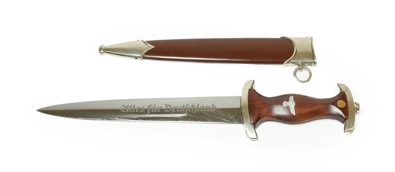 Lot 171 - A German Third Reich Transitional SA Dagger, the 22cm double edge steel blade etched Alles fur...