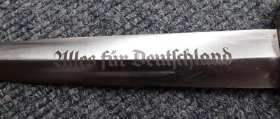 Lot 171 - A German Third Reich Transitional SA Dagger, the 22cm double edge steel blade etched Alles fur...