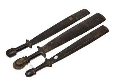 Lot 194 - A Massim, Trobriand Islands Sword Club, of ebony type wood, with large flat rectangular blade,...