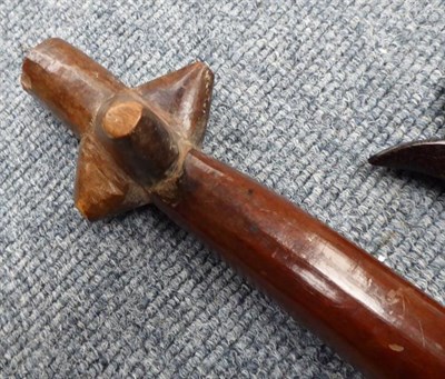 Lot 205 - A Vanuatu War Club, of dark red hard wood, with three conical protrusions to the head (one...