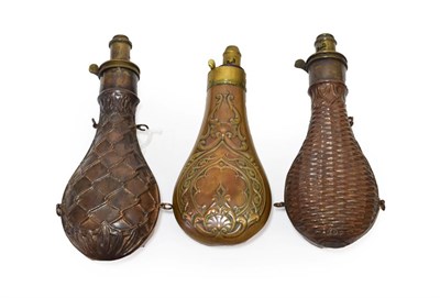 Lot 220 - Three 19th Century Copper Powder Flasks, one by G & J W Hawksley embossed with netting, the...