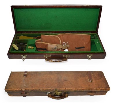 Lot 222 - An Early 20th Century Crushed Leather Shotgun Case, with brass lock, the green baize lined interior