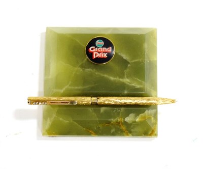 Lot 2040 - A 1970's Green Onyx Desktop Pen Holder/Paperweight, labelled Castrol Grand Prix, 10cm by 10cm