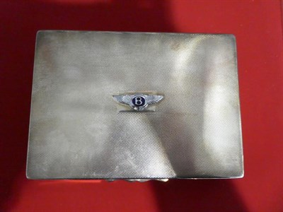 Lot 2107 - Bentley Interest: A Silver Plated Showroom or Desktop Cigar Case, with engine turned cover and...
