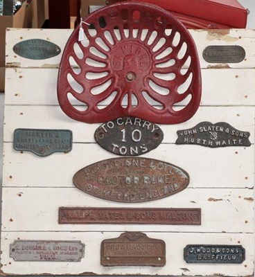 Lot 2135 - Tractor Interest: A Painted Display Board, mounted with a Bamford tractor seat and ten name plates
