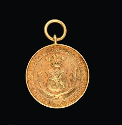 Lot 2044 - A Victorian Gold Medal, Stamped '15ct', Dated 1897, circular the obverse with a shield chased...