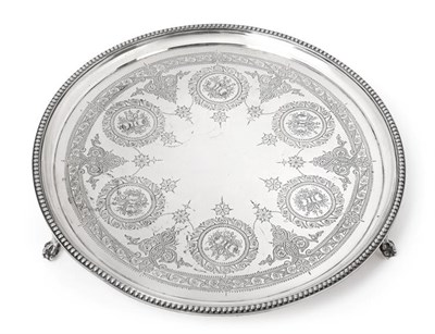 Lot 2057 - A Victorian Silver Salver, by Edward Ker Reid, London, 1871, circular and on three ball and...