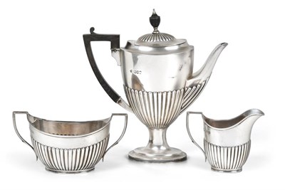 Lot 2082 - A Three-Piece Edward VII Silver Coffee-Service, by William Hutton and Sons, London, 1904 and...