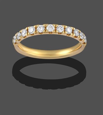 Lot 2137 - An 18 Carat Gold Diamond Half Hoop Ring, eleven round brilliant cut diamonds in yellow claw...