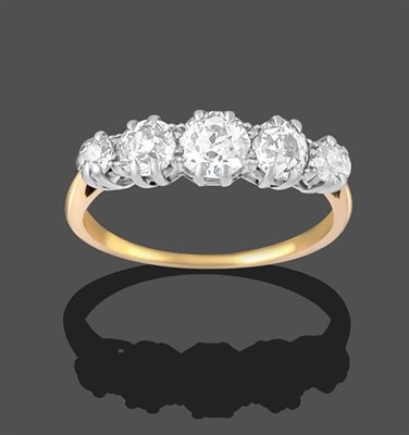 Lot 2150 - A Diamond Five Stone Ring, the graduated old cut diamonds in white claw settings, to a yellow...