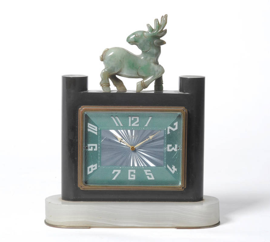 Lot 1500 - An Art Deco Mantel Clock, by G belin, the enamelled rectangular dial mounted in a black marble...