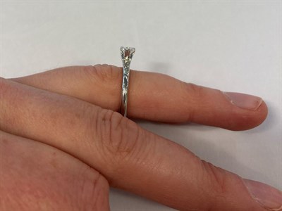 Lot 2158 - A Platinum Diamond Solitaire Ring, the round brilliant cut diamond in a three claw setting, to...