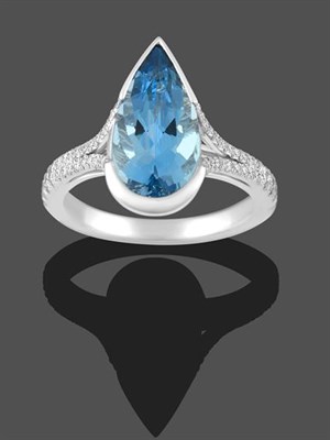 Lot 2166 - An Aquamarine and Diamond Ring, a pear cut aquamarine in a white semi-rubbed over setting to parted